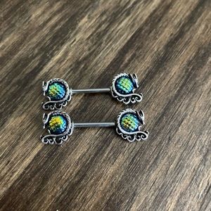 Iridescent dragon nipple rings